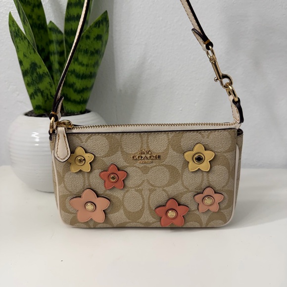 Coach Handbags - Coach Beige Floral Clutch with Pink and Yellow Accents